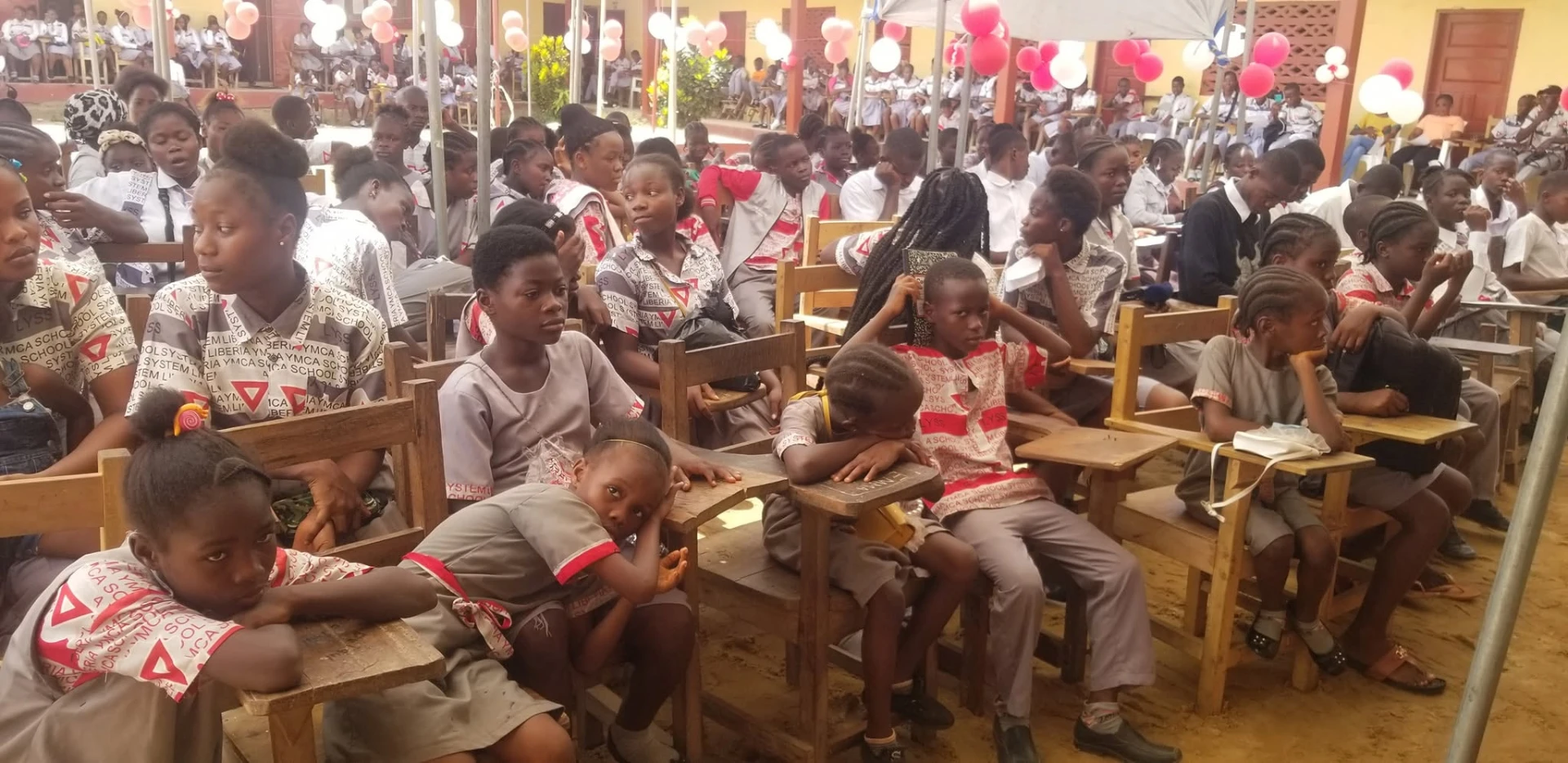 Students seated at desks during a school programme